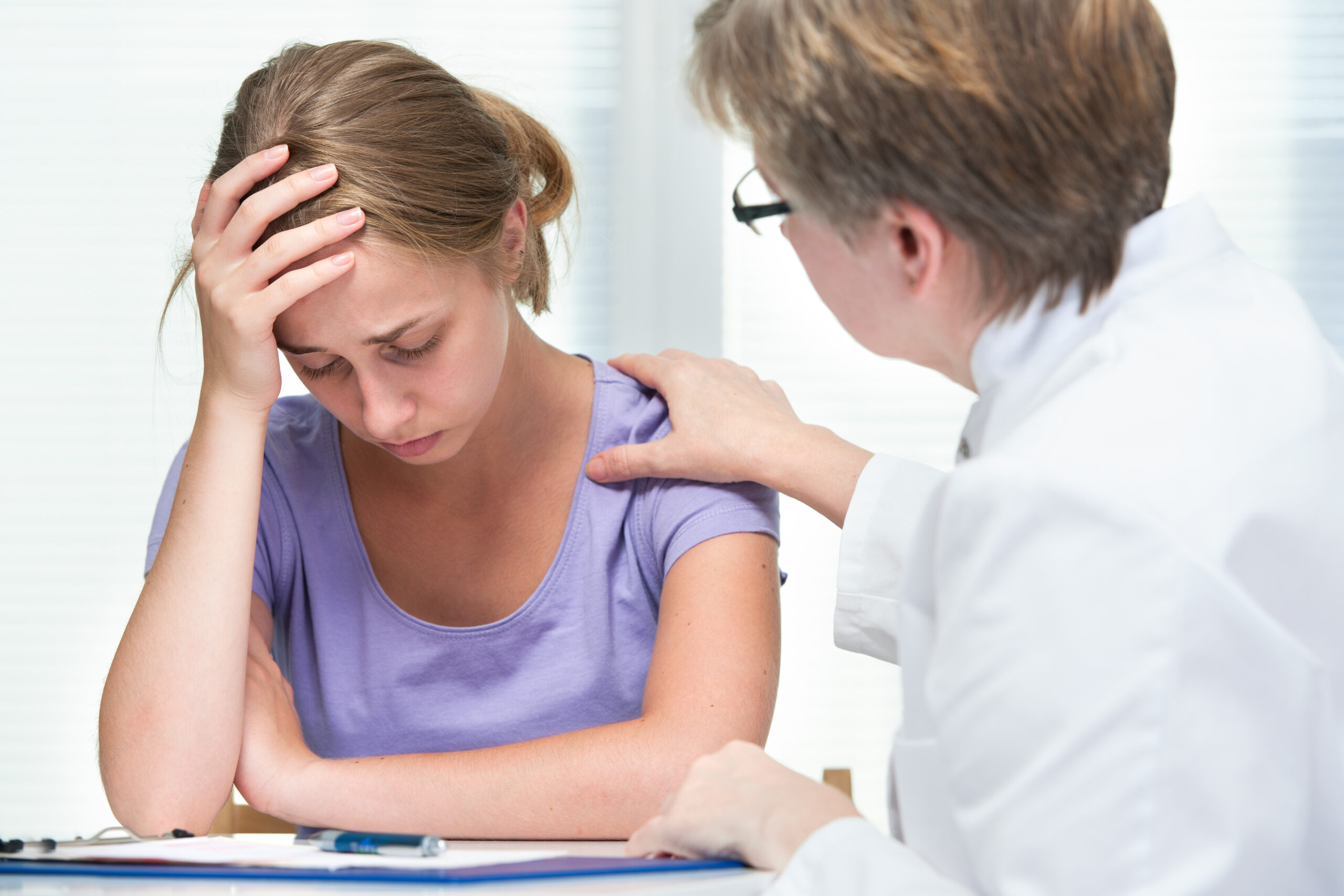 Child in conversation with a therapist
