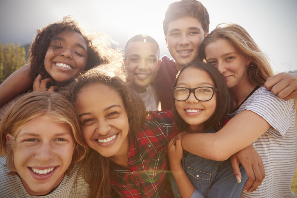Smiling teenage friends